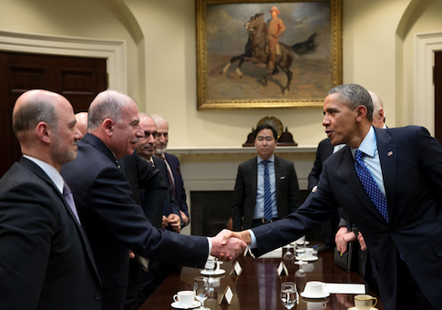 Muslim Brotherhood lobbyist Anas Altikriti standing next to Iraqi Parliament Speaker Usama al-Nujaifi shaking hands with President Obama