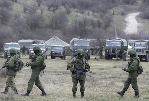 Russian soldiers guarding a Ukrainian infantry base / AP