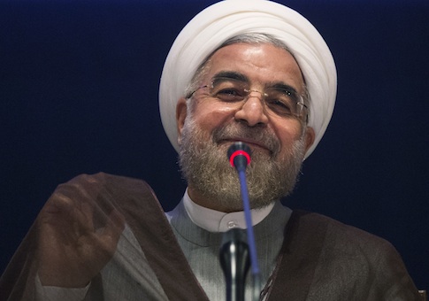 Iran's President Hassan Rouhani smiles while replying to a question during a news conference on the sidelines of the 69th United Nations General Assembly at United Nations Headquarters in New York September 26