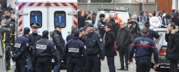 Police officers inspect the crime scene where at least 12 people were killed in a shooting at the offices of satirical weekly Charlie Hebdo in Paris, France, on Jan. 7, 2015
