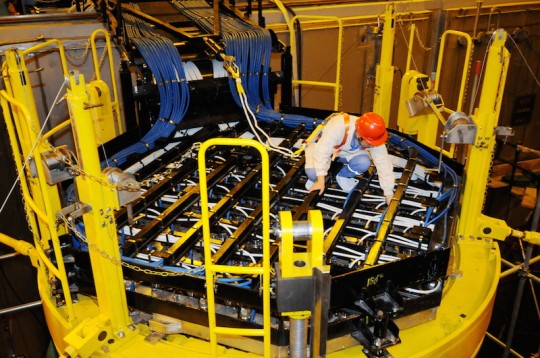A Chinese technician lays cables on a nuclear reactor built with the technologies of Hualong-1 reactor at Fangchenggang Nuclear Power Plant / AP