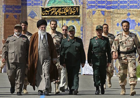In this picture released by an official website of the office of the Iranian supreme leader on Wednesday, May 20, 2015, Supreme Leader Ayatollah Ali Khamenei, second left, attends a graduation ceremony of Revolutionary Guard officers in Tehran, Iran, as he is accompanied by Chief of the General Staff of Iran's Armed Forces, Hasan Firouzabadi, left, and Revolutionary Guard commander Mohammad Ali Jafar, center. Iran's supreme leader vowed Wednesday he will not allow international inspection of Iran's military sites or access to Iranian scientists under any nuclear agreement with world powers