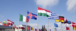 Flags flutter in the wind in front of NATO headquarters in Brussels