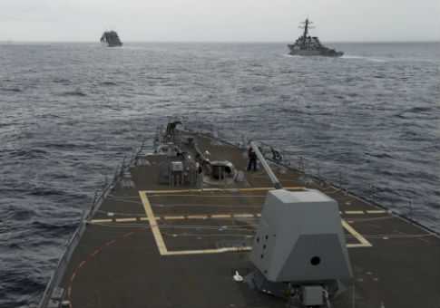 U.S. Navy destroyers conduct a freedom of navigation operation in the South China Sea / AP