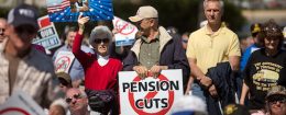 Attendees rally on the West Front of the U.S. Capitol building with Teamsters Union retirees who traveled from across the country to voice their opposition to deep cuts to their pension benefits