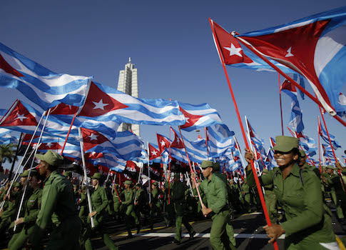 Cuban soldiers bearing their national flag / AP