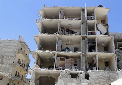 A damaged building is pictured at a site in al-Katerji district in Aleppo