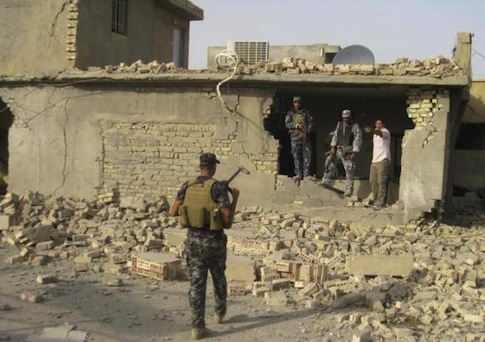 Security personnel gather at the site of a bomb attack in Samarra, 100 km (62 miles) north of Baghdad, August 13, 2010.