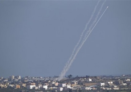 A rocket fired by Palestinian militants from inside Gaza Strip makes its way towards Israel
