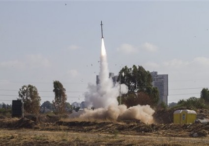 An Iron Dome air defense system fires to intercept a rocket from the Gaza Strip in Tel Aviv