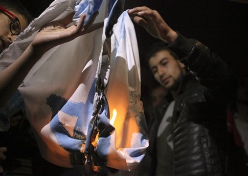 Followers of the Muslim Brotherhood Islamic movement burn a representation of an Israeli flag
