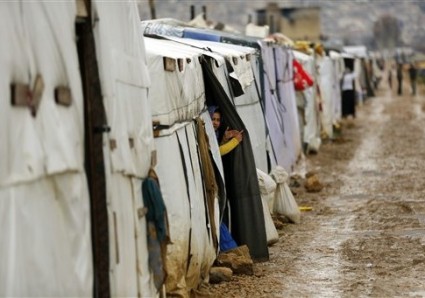 Syrian refugees gather in the Fayda Camp