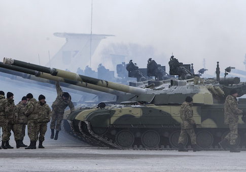 Ukrainian soldiers get new tanks and other military vehicles at a military base in the eastern town of Chuguyev, Ukraine