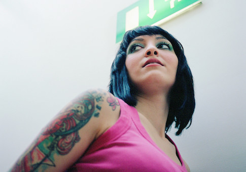 Woman with tattooed arm