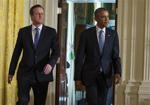 President Barack Obama and British Prime Minister David Cameron arrive for their joint news conference in the East Room of the White House in Washington, Friday, Jan. 16, 2015