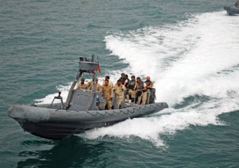 A Kuwait Navy rigid-hulled inflatable boat speeds toward U.S. Army Vessel “Corinth” as part of a visit, board, search and seizure scenario during Exercise Eagle Resolve March 17, 2015