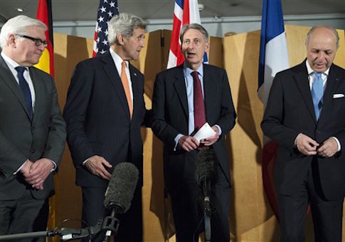 From left, German Foreign Minister Frank Walter Steinmeier, U.S. Secretary of State John Kerry, British Foreign Secretary Philip Hammond and French Foreign Minister Laurent Fabius talk after Hammond made a statement about their meeting regarding recent negotiations with Iran over Iran's nuclear program in London, England, Saturday, March 21