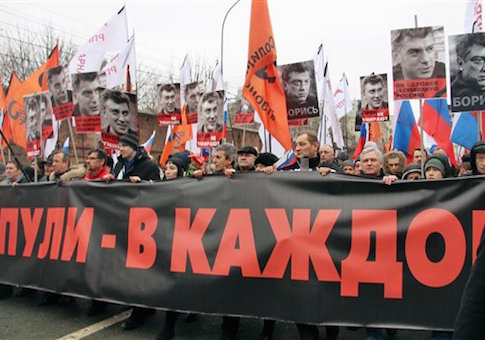 People hold pictures of Boris Nemtsov