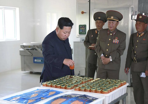 North Korean leader Kim Jong Un gives field guidance at the 810 army unit‚Äôs Salmon farms in this undated photo