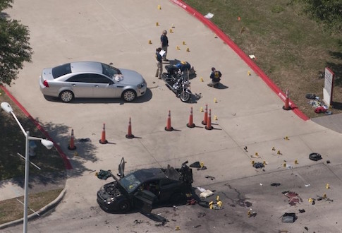 An aerial view shows the area around a car that was used the previous night by two gunmen, who were killed by police, as it is investigated by local police and the FBI