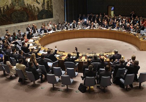 Members of the Security Council vote at United Nations headquarters, Monday, July 20, 2015. The U.N. Security Council unanimously endorsed the landmark nuclear deal between Iran and six world powers and adopted a series of measures leading to the end of U.N. sanctions that have hurt the Iranian economy