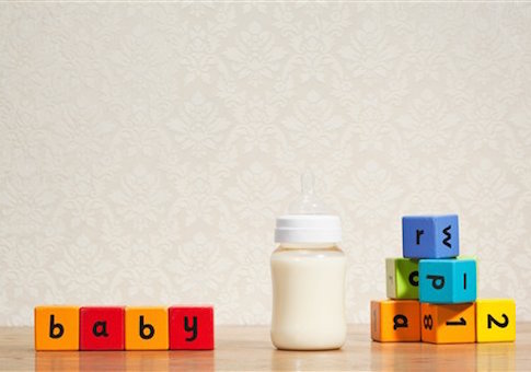 Baby milk and alphabet blocks