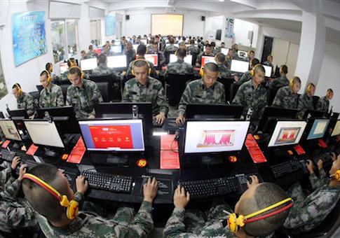 Chinese soldiers browse online news on desktop computers at a garrison of the PLA