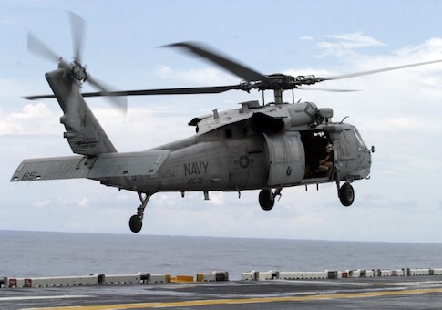 U.S.Navy MH-60 Night Hawk helicopter prepares to land on the deck of the USS Kearsarge ship
