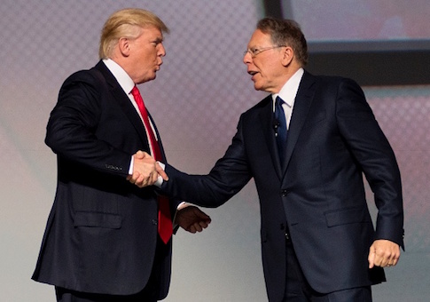 US President Donald Trump shakes hands with National Rifle Association (NRA) President Wayne LaPierre