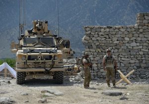 U.S. soldiers patrol near the site of a U.S. bombing during an operation against Islamic State (IS) militants in the Achin district of Afghanistan's Nangarhar province on April 15