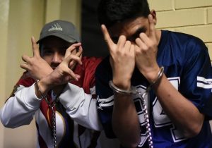 Members of MS-13 flash their gang gesture / Getty Images