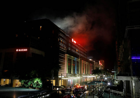 Smoke billows from the Resorts World building in Pasay City, Metro Manila, Philippines