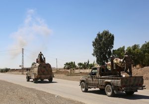 Syrian Democratic Forces made up of an alliance of Kurdish and Arab fighters, drive on the outskirts of an eastern entrance to the Al-Meshleb neighborhood of Raqq
