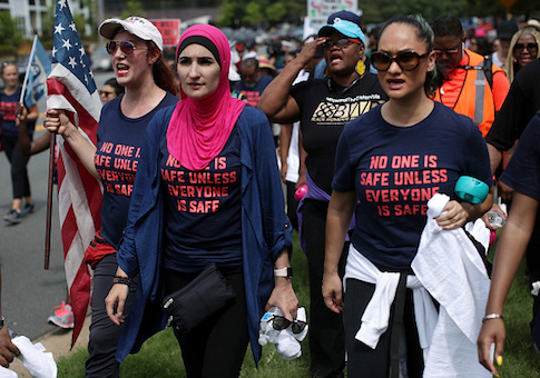 Activist Linda Sarsour and fellow gun-control activists participate in a march beginning at the headquarters of National Rifle Association