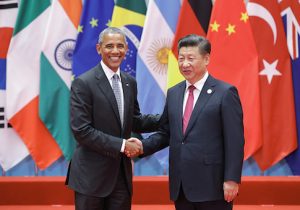 U.S. President Barack Obama shakes hands with Chinese President Xi Jinping