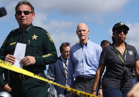 Broward County Sheriff Scott Israel and Florida Governor Rick Scott walk up to the media to speak about the mass shooting at Marjory Stoneman Douglas High School