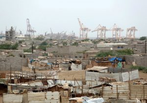 Hodeidah port's cranes are pictured from a nearby shantytown in Hodeidah, Yemen
