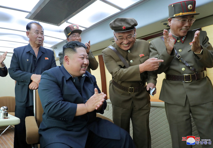KCNA picture of North Korean leader Kim Jong Un guiding the test firing of a new weapon