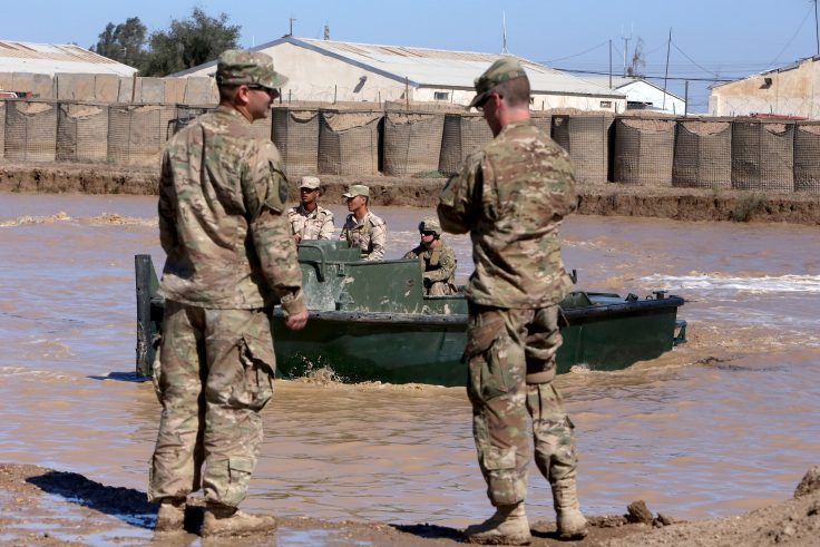 U.S. army forces supervise during a training session at the Taji camp, north of Baghdad in 2017