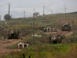 Israeli self-propelled howitzers are positioned in the Israeli-annexed Golan Heights on the border with Syria
